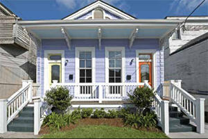 After: The now-purple duplex is elegant inside and out and shows no signs of its former self. (Redmellon Restoration & Development)