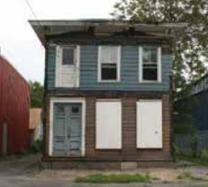 This house at 318 Marcellus St. in Syracuse was abandoned. Its rehabilitation included a new porch and Victorian front, helping revitalize the historic Salt District area. (Home HeadQuarters)