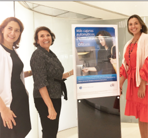 Spanish language marketing in Continental Bank's lobby in Miami is presented by, from left, Sonia Canessa-Gonzalez, CFO of Continental National Bank; Natalie